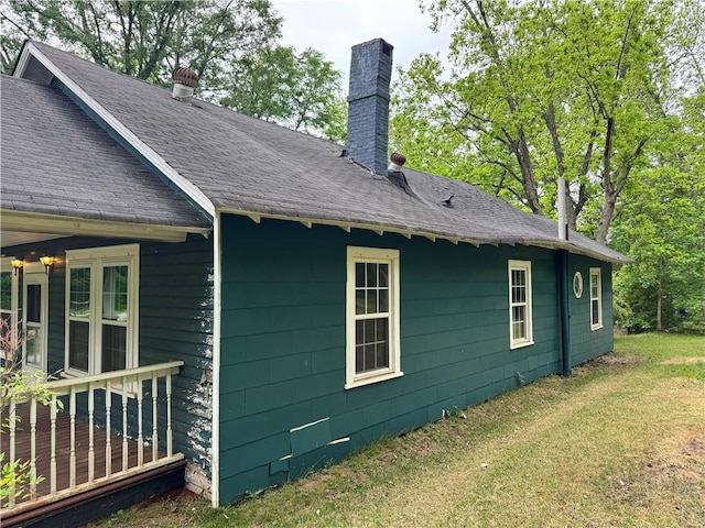 202 E Railroad St, Valley, AL 36854 - view of side of property featuring a chimney, a yard, and roof with shingles