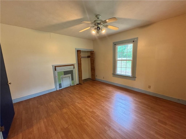 202 E Railroad St, Valley, AL 36854 - unfurnished living room featuring a ceiling fan, wood finished floors, and baseboards