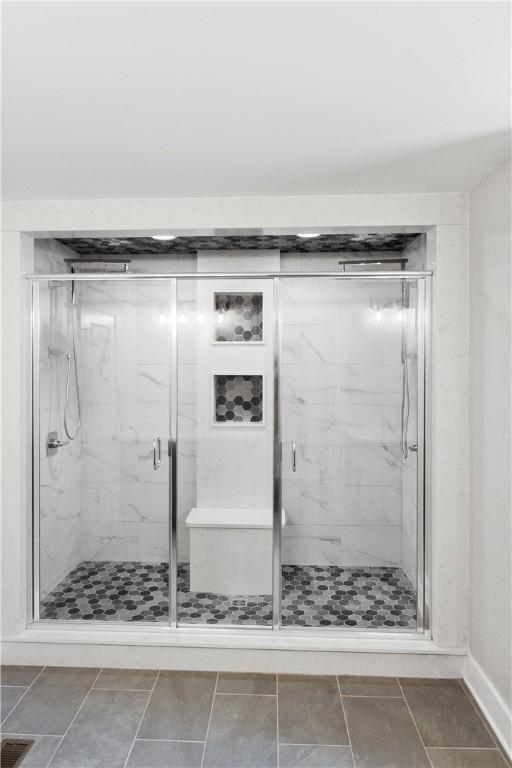 bathroom featuring an enclosed shower