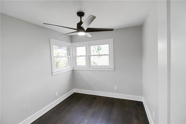 unfurnished room featuring ceiling fan and dark wood-type flooring