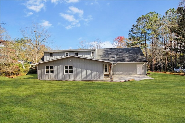 back of property featuring a patio and a lawn