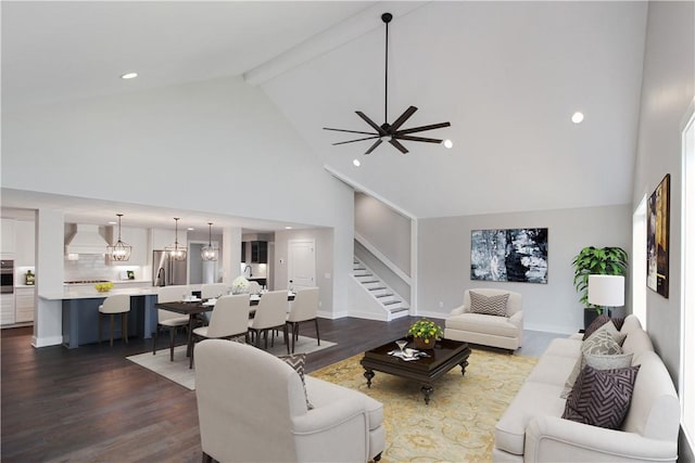 living room with beam ceiling, ceiling fan with notable chandelier, high vaulted ceiling, and wood-type flooring