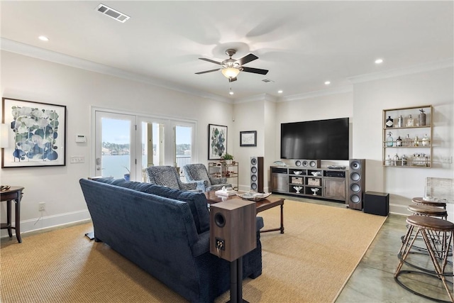 living room featuring ornamental molding and ceiling fan