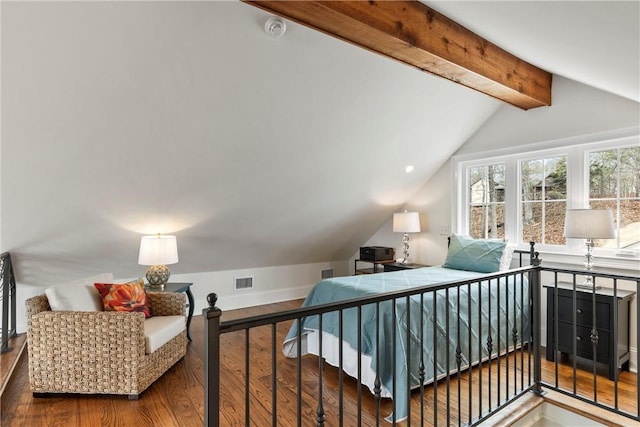 bedroom with wood-type flooring and lofted ceiling with beams