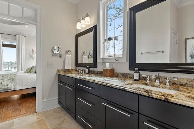 bathroom with tile patterned flooring and vanity