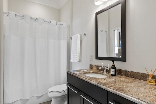 full bathroom featuring vanity, shower / tub combo, and toilet