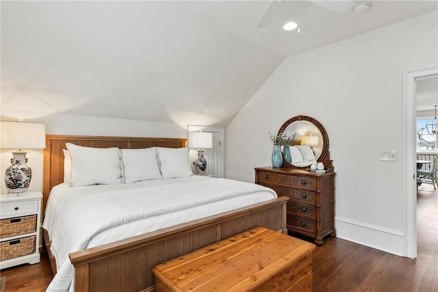 bedroom featuring ceiling fan, dark hardwood / wood-style flooring, and vaulted ceiling