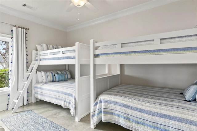 bedroom with ornamental molding and ceiling fan