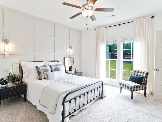 0104 Bradley Ln, Auburn, AL 36830 - bedroom with a decorative wall, carpet floors, and ceiling fan