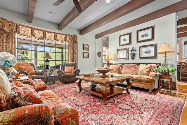 living room with beamed ceiling, ceiling fan, and hardwood / wood-style flooring