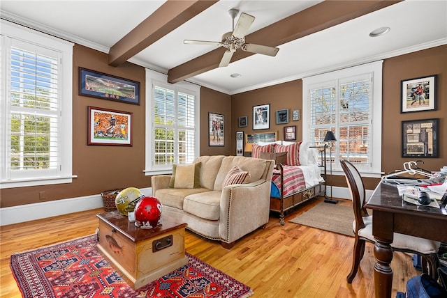 bedroom featuring ceiling fan, beam ceiling, light wood-type flooring, and multiple windows