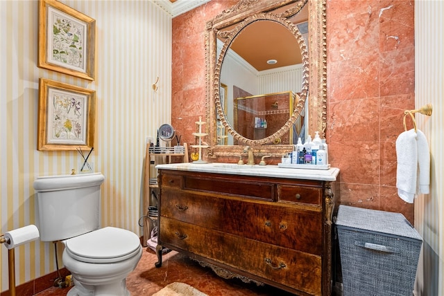 bathroom featuring vanity, toilet, and crown molding