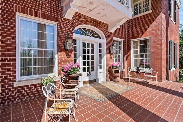 doorway to property with a patio area