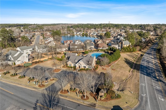 drone / aerial view with a residential view and a water view