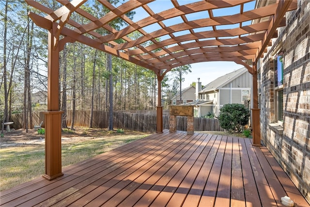 wooden terrace featuring fence and a pergola