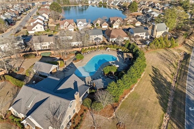 aerial view with a residential view and a water view