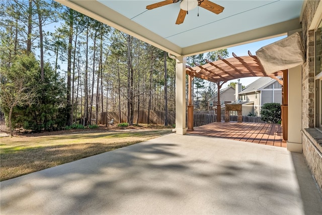 view of patio / terrace with ceiling fan and a pergola