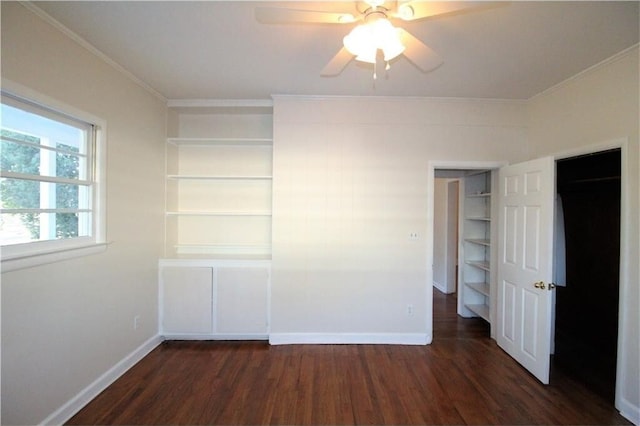 unfurnished bedroom with dark wood-type flooring, ceiling fan, and ornamental molding