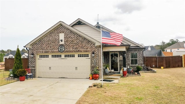 view of front of house featuring a garage and a front lawn