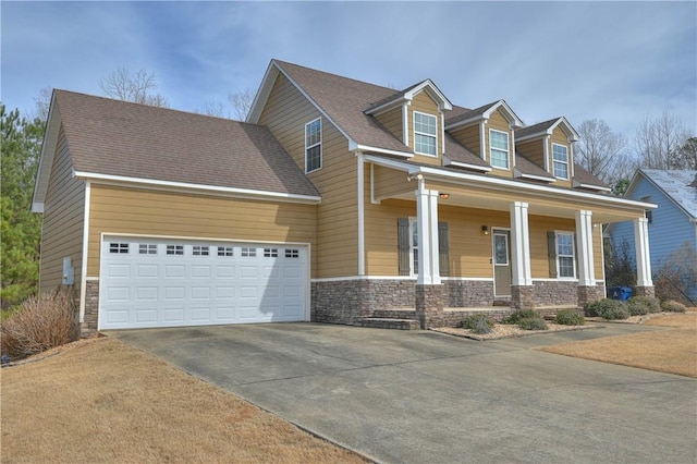 cape cod home with a garage and a porch