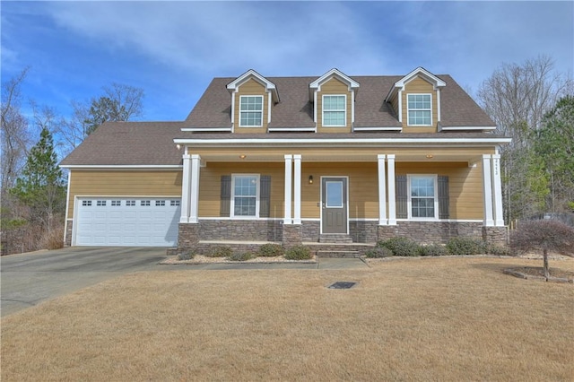 cape cod home featuring a garage and a porch