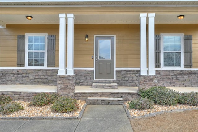 doorway to property with covered porch