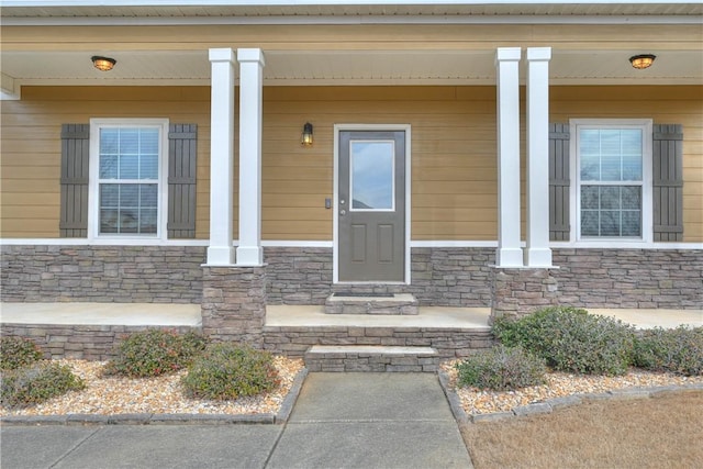 2472 Waterstone Cir, Auburn, AL 36832 - doorway to property featuring a porch and stone siding