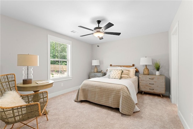 bedroom featuring baseboards and light carpet