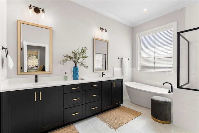 full bathroom with a freestanding bath, double vanity, a stall shower, and ornamental molding