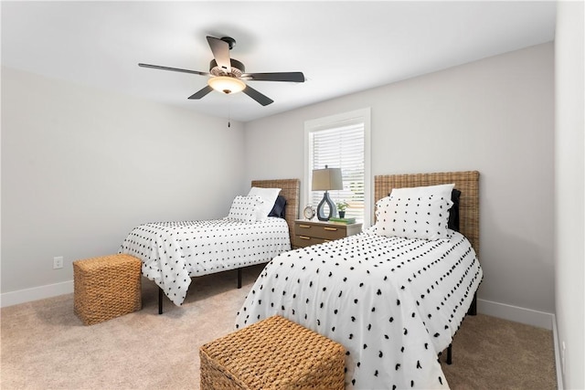 bedroom with carpet flooring, baseboards, and ceiling fan