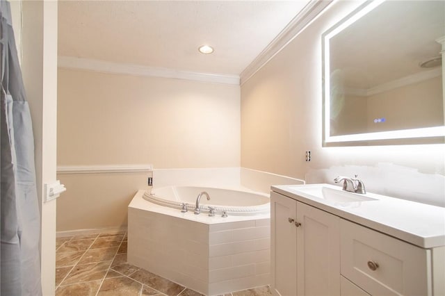 bathroom featuring ornamental molding, tiled bath, and vanity