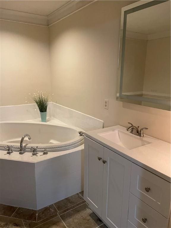 bathroom with ornamental molding, tiled tub, and vanity