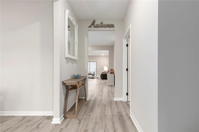 hallway with light wood-type flooring