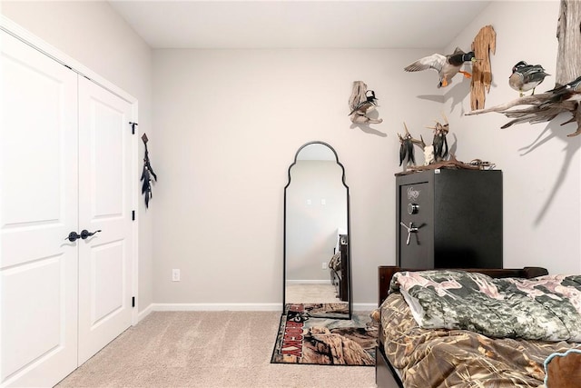 carpeted bedroom featuring a closet