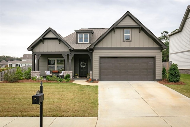 craftsman house with covered porch and a front yard