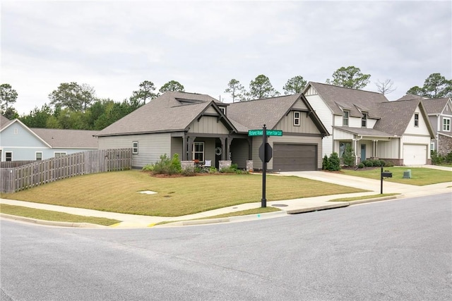 view of front of home featuring a front yard and a garage