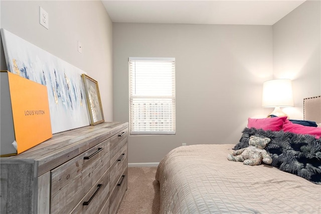 bedroom with carpet and multiple windows