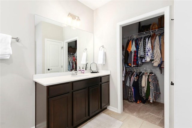 bathroom featuring tile patterned flooring and vanity