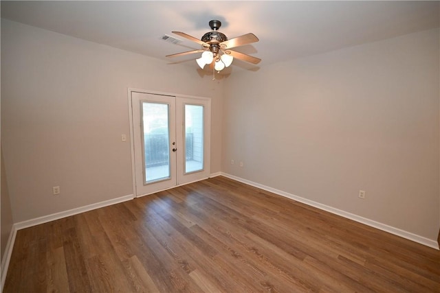 3297 S College St Unit C101, Auburn, AL 36830 - spare room with ceiling fan, french doors, dark wood finished floors, and baseboards