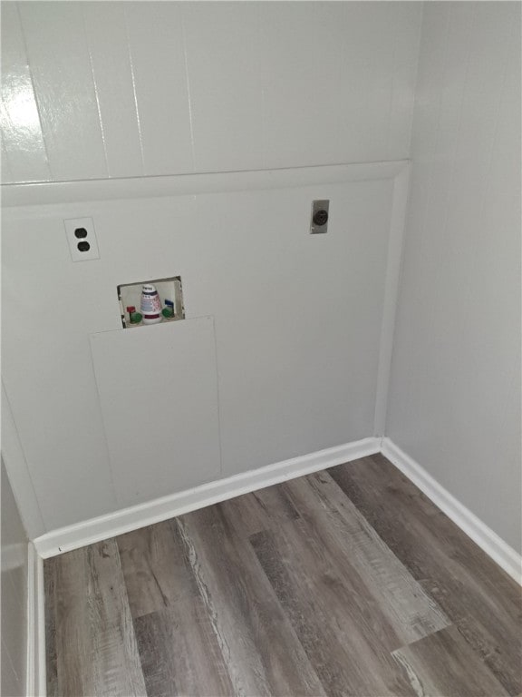 laundry area with laundry area, washer hookup, dark wood-style flooring, baseboards, and electric dryer hookup