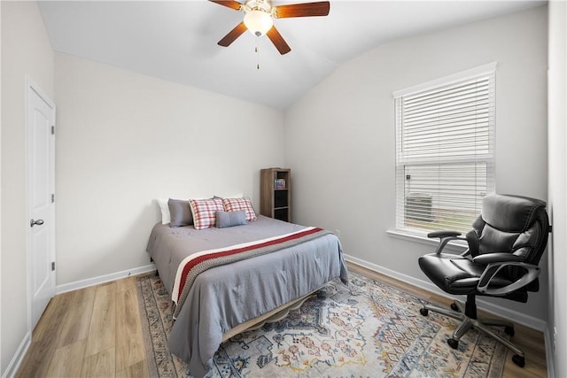 2144 Covey Dr, Auburn, AL 36879 - bedroom with lofted ceiling, wood finished floors, and ceiling fan