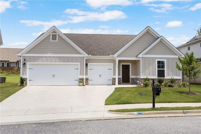 2144 Covey Dr, Auburn, AL 36879 - view of front facade with board and batten siding, roof with shingles, driveway, and a front lawn