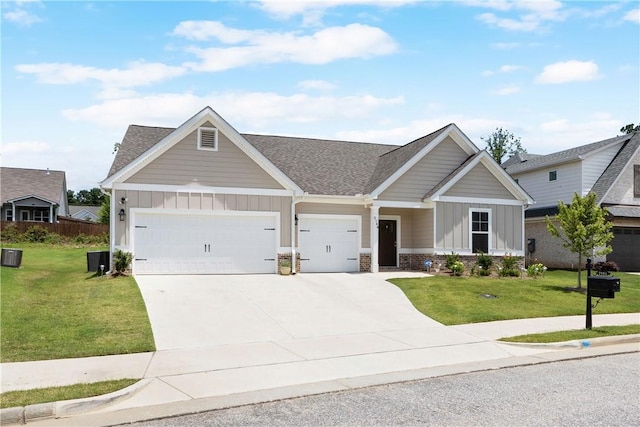 2144 Covey Dr, Auburn, AL 36879 - view of front of house featuring board and batten siding, roof with shingles, a garage, and a front yard