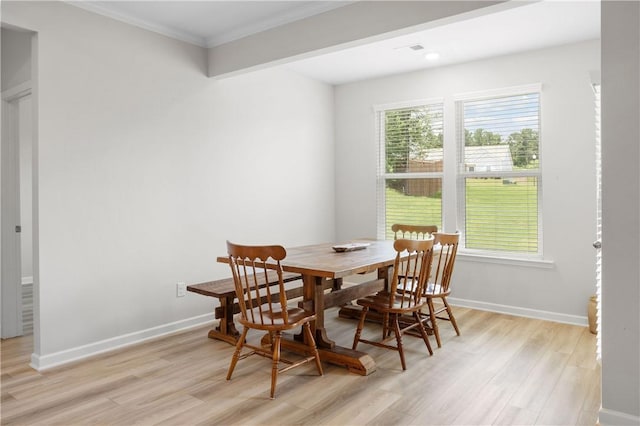 2144 Covey Dr, Auburn, AL 36879 - dining room featuring light wood-style flooring, healthy amount of natural light, and crown molding