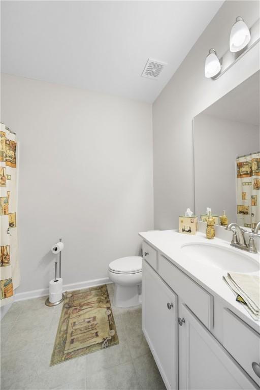 2144 Covey Dr, Auburn, AL 36879 - bathroom with vanity and a shower with shower curtain