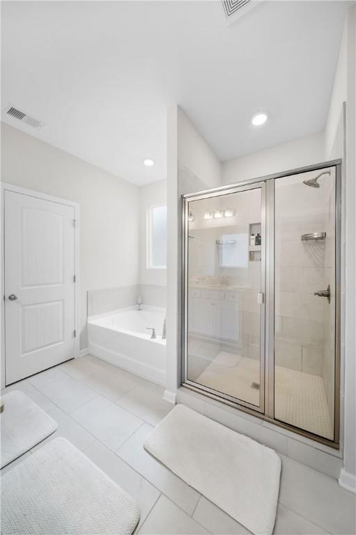 2144 Covey Dr, Auburn, AL 36879 - full bath with a garden tub, a shower stall, tile patterned floors, and recessed lighting