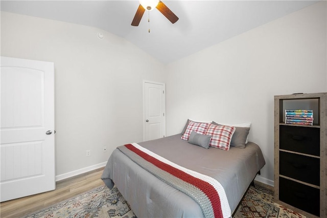 2144 Covey Dr, Auburn, AL 36879 - bedroom featuring vaulted ceiling, wood finished floors, and a ceiling fan