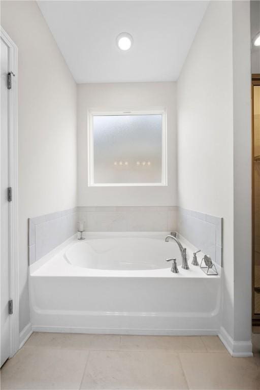 2144 Covey Dr, Auburn, AL 36879 - bathroom with a garden tub and tile patterned floors