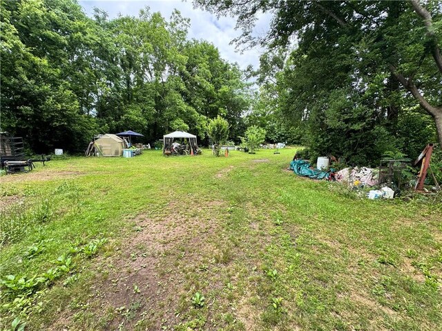 108 Carr St, Tallassee, AL 36078 - view of green lawn featuring an outbuilding