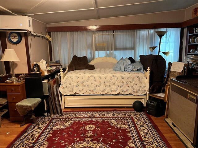 108 Carr St, Tallassee, AL 36078 - bedroom featuring wood finished floors and a wall unit AC
